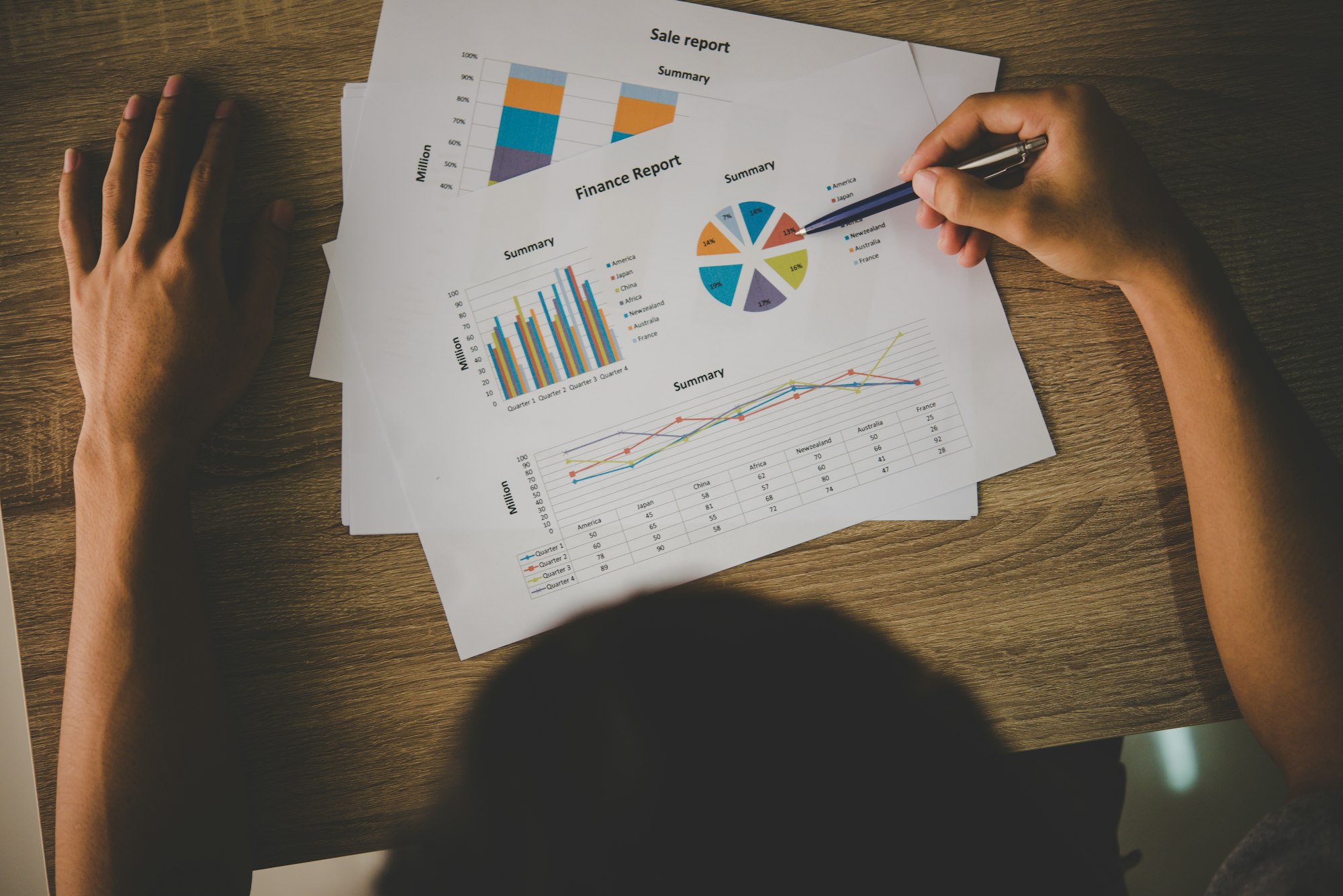 Businessman holding and analyzing investment chart working in office. Business work concept.